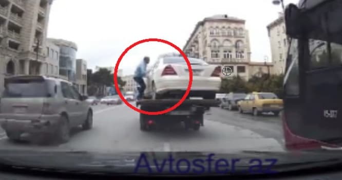 Bakıda maşınını evakuator aparan sürücü görün nələr etdi - VİDEO
