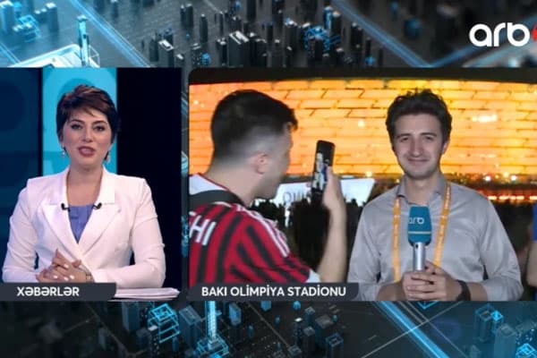 İngilis azarkeşlər Bakıda jurnalistə çətin anlar yaşatdı (VİDEO)