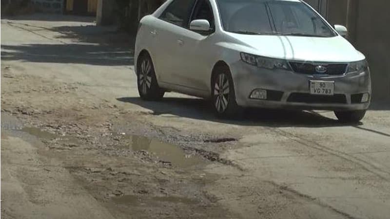 "Azərsu" Xırdalanda yolu bərbad hala saldı (VİDEO)